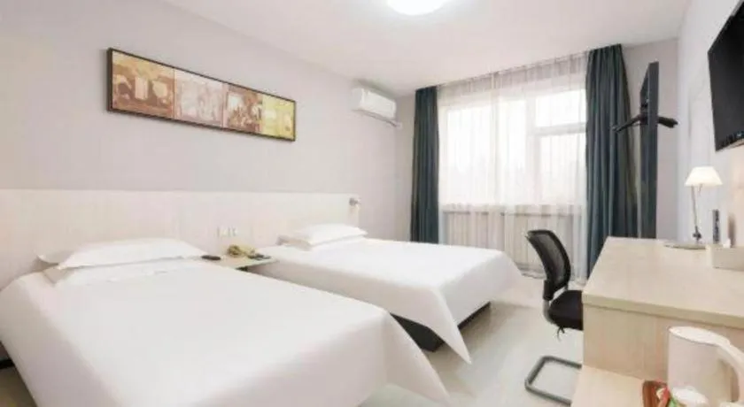Bed in Jinjiang Inn Dalian Development Zone Jinma Road Light Railway Station