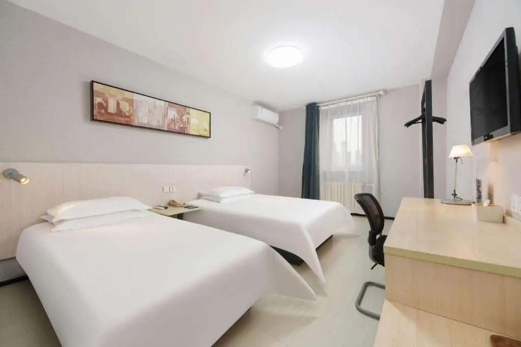 Bed in Jinjiang Inn Dalian Development Zone Jinma Road Light Railway Station