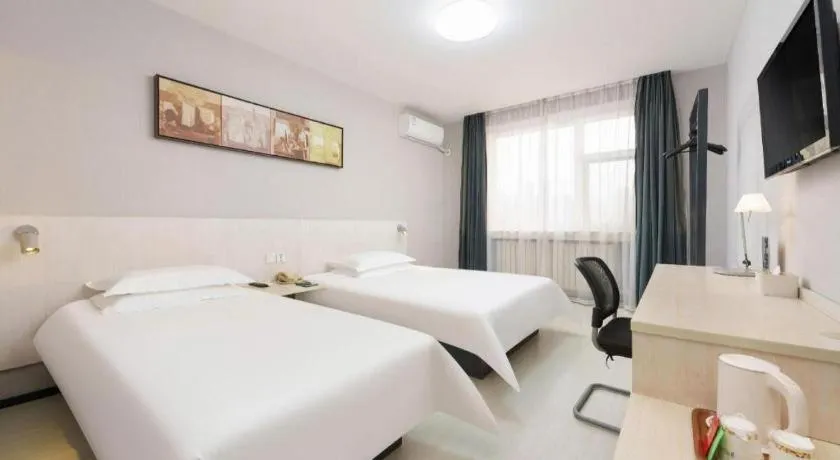 Bed in Jinjiang Inn Dalian Development Zone Jinma Road Light Railway Station