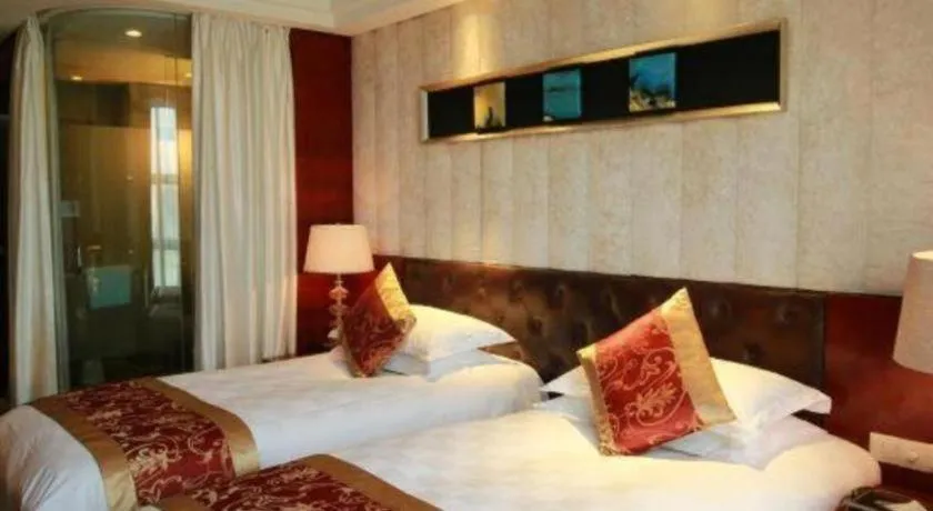 Bed in Maison New Century Hotel Wuyuan Haiyan