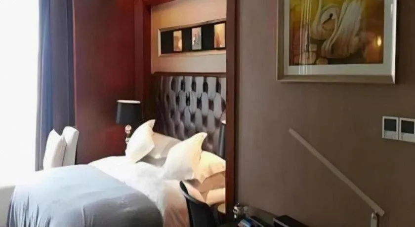 Bed in Maison New Century Hotel Wuyuan Haiyan