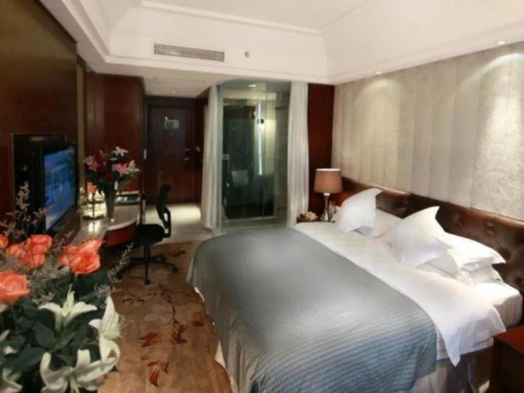 Bed in Maison New Century Hotel Wuyuan Haiyan