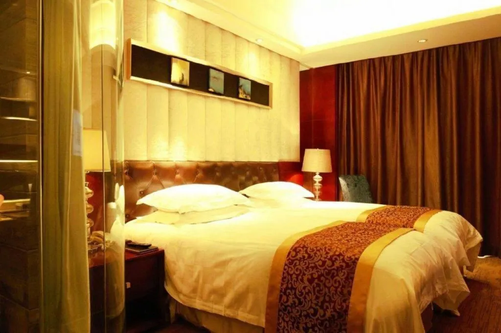 Bed in Maison New Century Hotel Wuyuan Haiyan