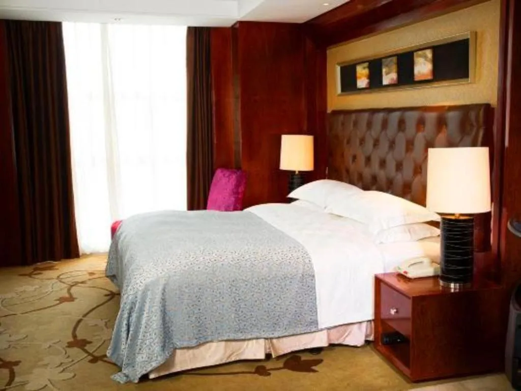 Bed in Maison New Century Hotel Wuyuan Haiyan