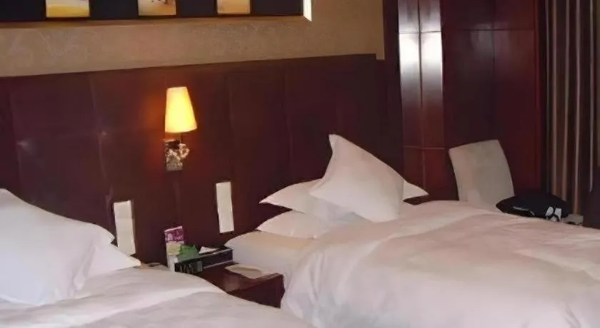 Bed in Maison New Century Hotel Wuyuan Haiyan