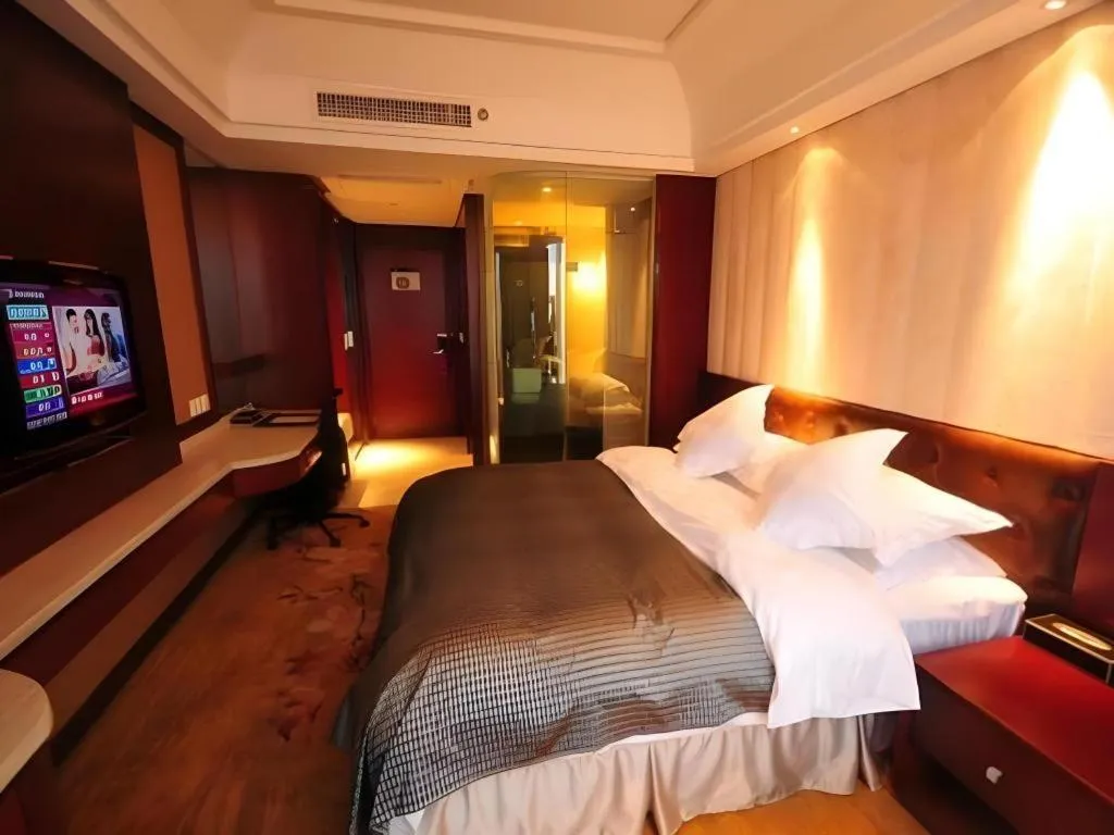 Bed in Maison New Century Hotel Wuyuan Haiyan