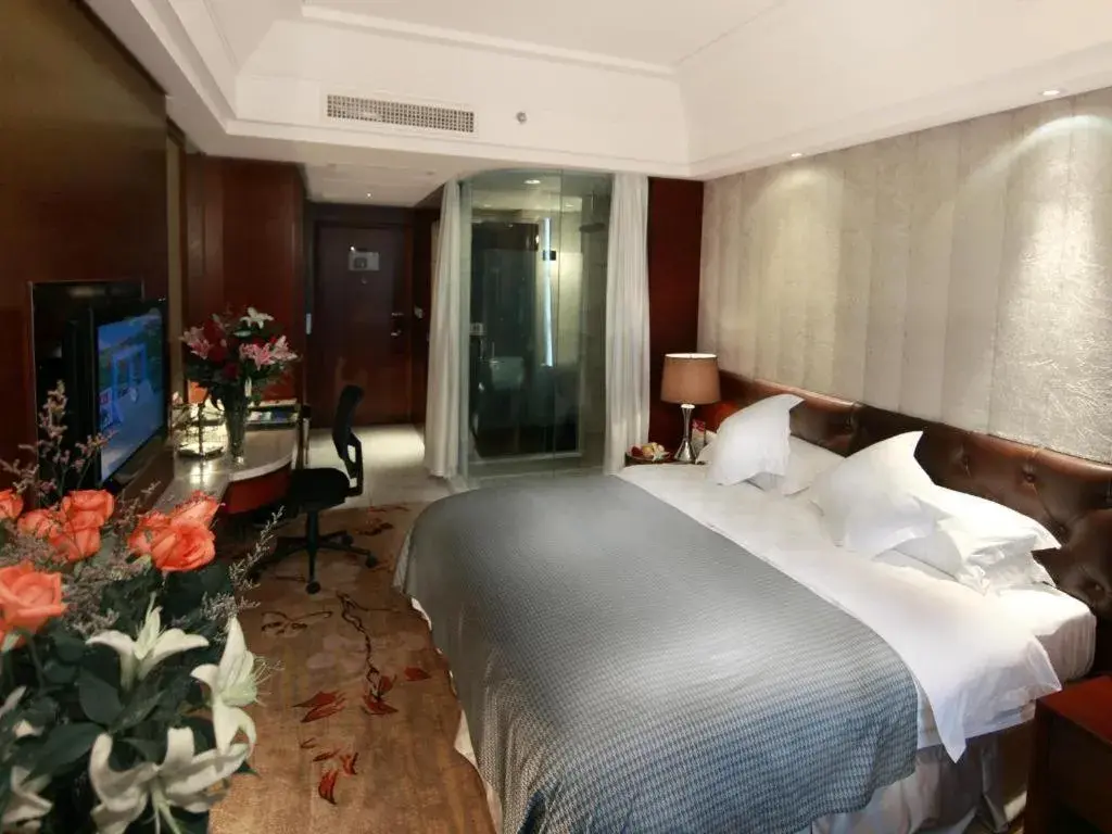 Bed in Maison New Century Hotel Wuyuan Haiyan Bed in Maison New Century Hotel Wuyuan Haiyan