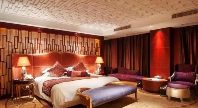 Bed in Maison New Century Hotel Wuyuan Haiyan Bed in Maison New Century Hotel Wuyuan Haiyan