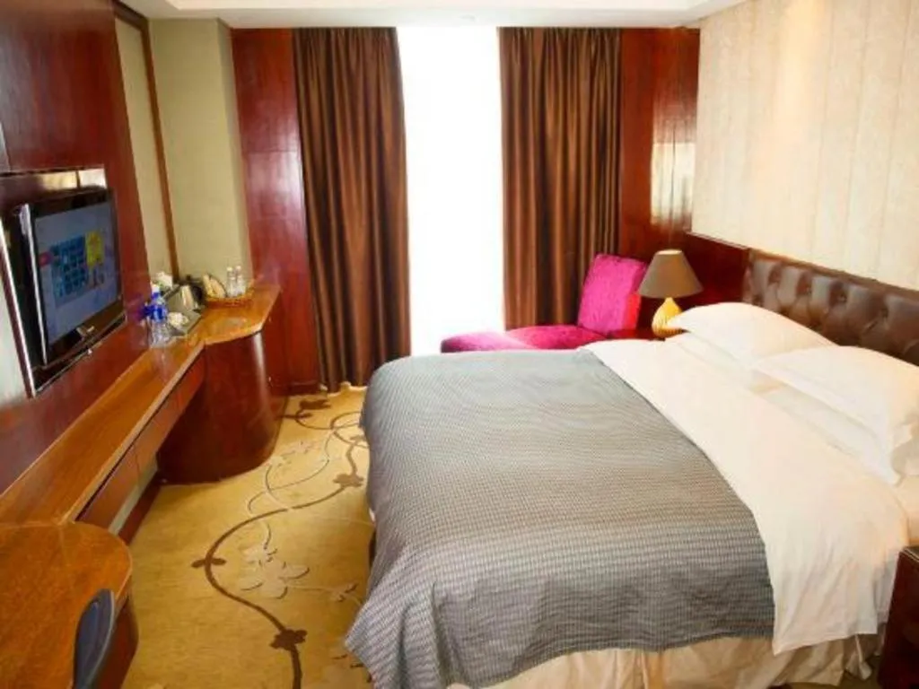 Bed in Maison New Century Hotel Wuyuan Haiyan