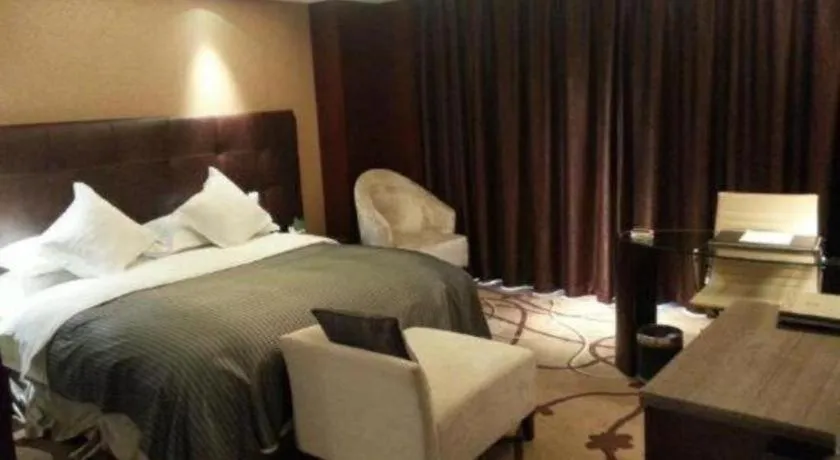 Bed in Maison New Century Hotel Wuyuan Haiyan