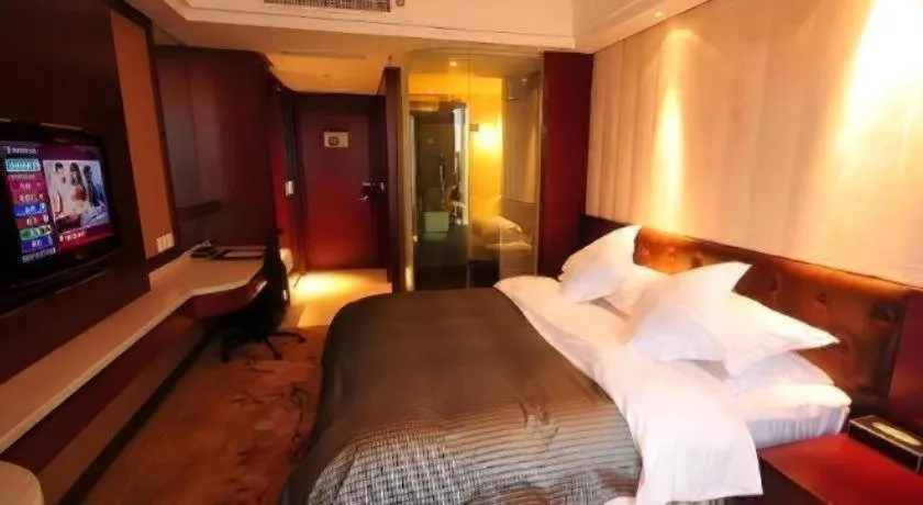 Bed in Maison New Century Hotel Wuyuan Haiyan