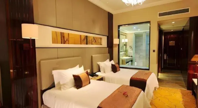 Bed in Maison New Century Hotel Wuyuan Haiyan Bed in Maison New Century Hotel Wuyuan Haiyan