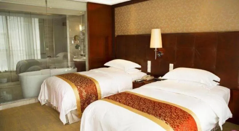 Bed in Maison New Century Hotel Wuyuan Haiyan