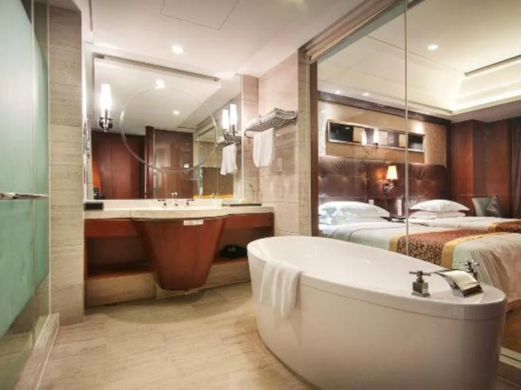 Bed in Maison New Century Hotel Wuyuan Haiyan