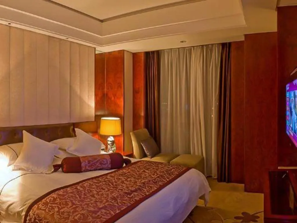 Bed in Maison New Century Hotel Wuyuan Haiyan