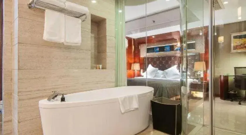 Bed in Maison New Century Hotel Wuyuan Haiyan Bed in Maison New Century Hotel Wuyuan Haiyan