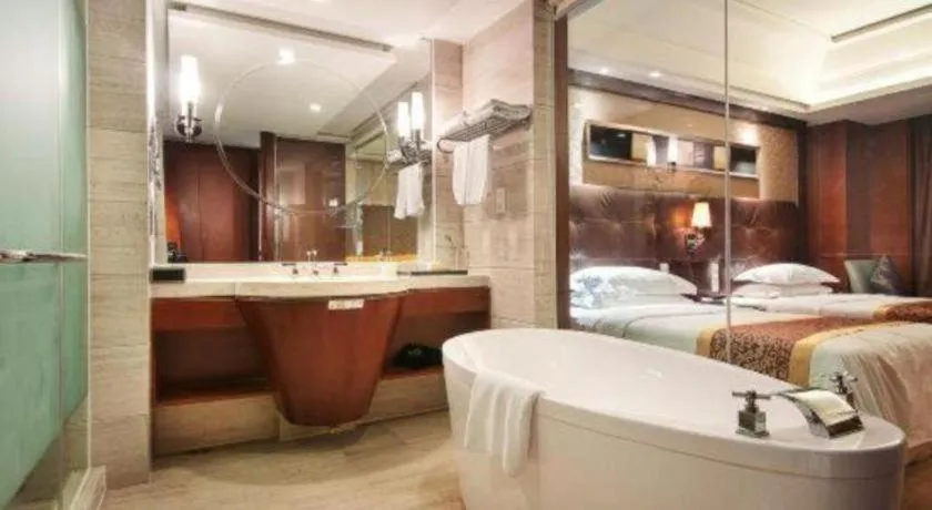 Bed in Maison New Century Hotel Wuyuan Haiyan