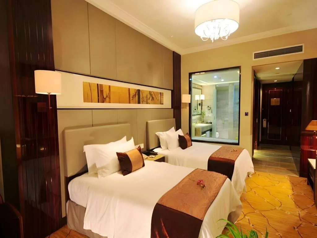 Bed in Maison New Century Hotel Wuyuan Haiyan