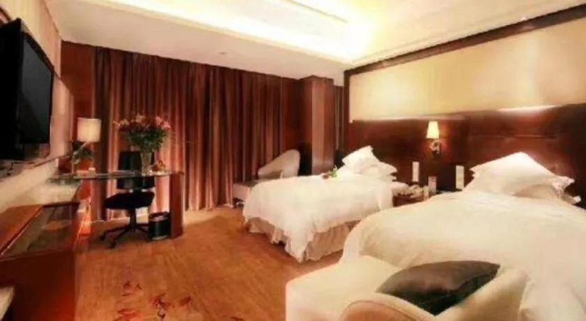 Bed in Maison New Century Hotel Wuyuan Haiyan