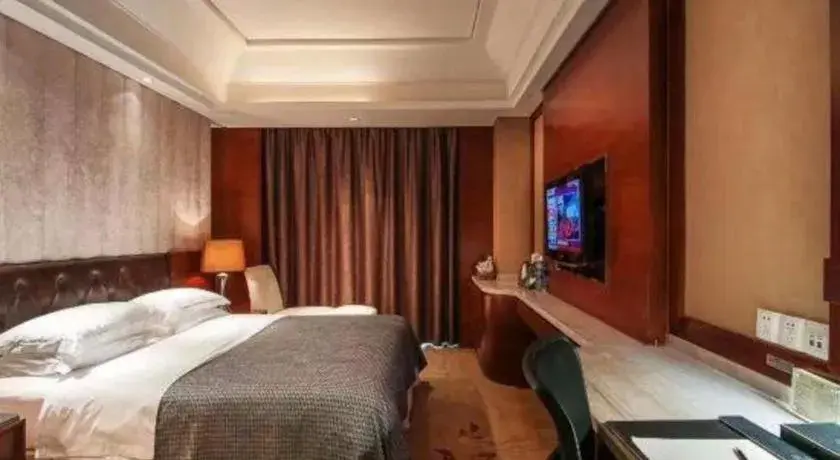 Bed in Maison New Century Hotel Wuyuan Haiyan Bed in Maison New Century Hotel Wuyuan Haiyan