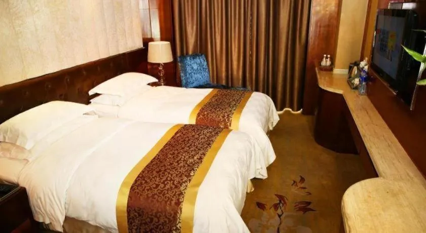 Bed in Maison New Century Hotel Wuyuan Haiyan