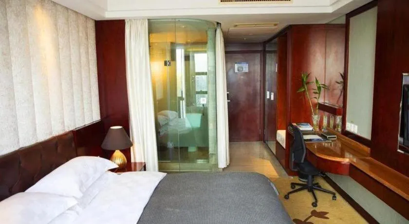 Bed in Maison New Century Hotel Wuyuan Haiyan