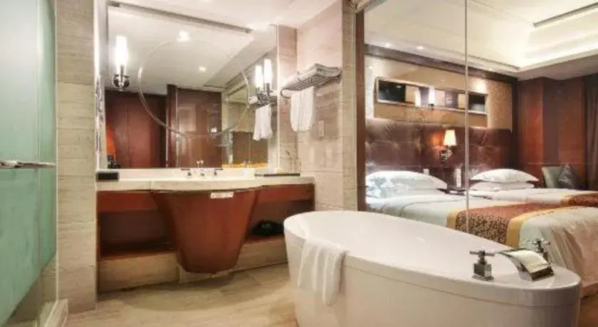 Bed in Maison New Century Hotel Wuyuan Haiyan Bed in Maison New Century Hotel Wuyuan Haiyan