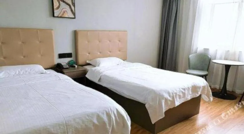 Bed in GreenTree Inn Huaian Lianshui Jindi International Garden Business Hotel