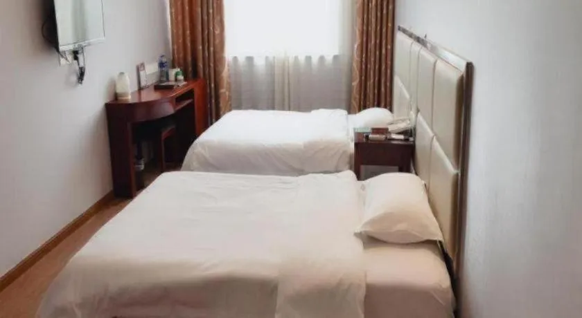 Bed in GreenTree Inn Huaian Lianshui Jindi International Garden Business Hotel