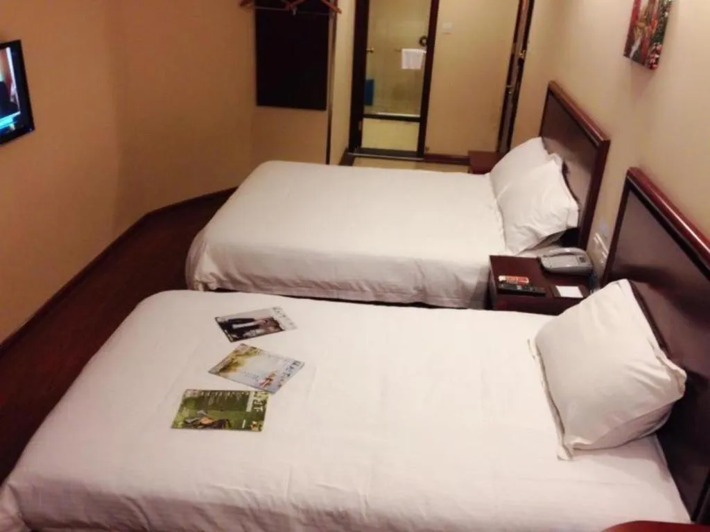 Bed in GreenTree Inn Huaian Lianshui Jindi International Garden Business Hotel