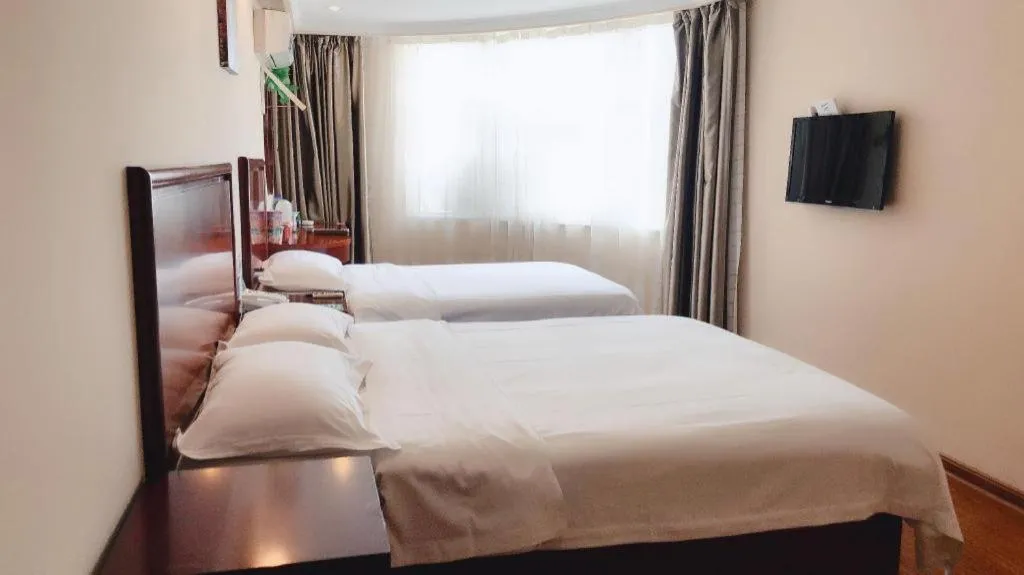 Bed in GreenTree Inn Huaian Lianshui Jindi International Garden Business Hotel