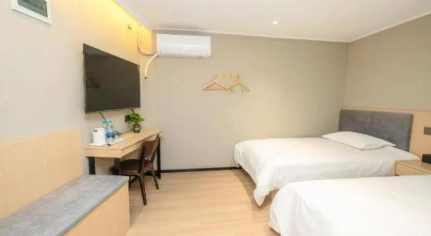 Bed in GreenTree Inn Shanghai South Railway Station Xujiahui Stadium Subway Station Shell Hotel