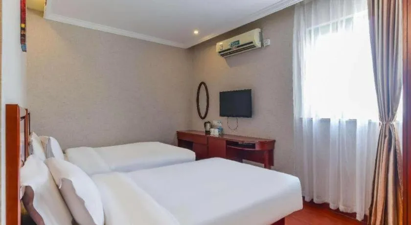 Bed in GreenTree Inn Shanghai South Railway Station Xujiahui Stadium Subway Station Shell Hotel