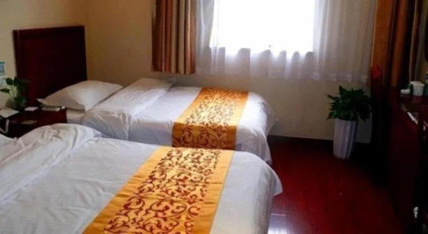 Bed in GreenTree Inn Shanghai South Railway Station Xujiahui Stadium Subway Station Shell Hotel