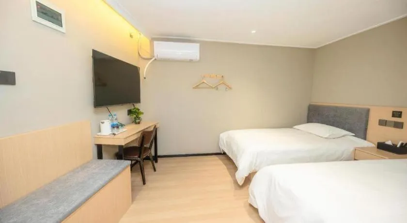 Bed in GreenTree Inn Shanghai South Railway Station Xujiahui Stadium Subway Station Shell Hotel