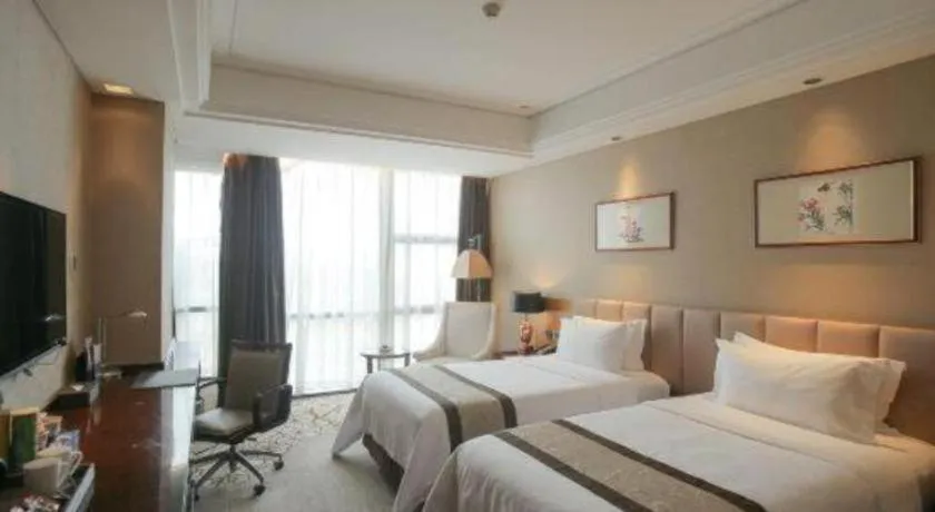 Bed in Zhangjiagang Zhonglian GDH International Hotel