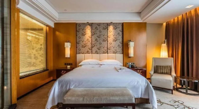 Bed in Zhangjiagang Zhonglian GDH International Hotel