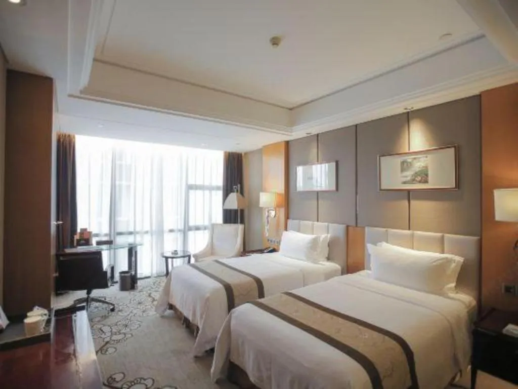 Bed in Zhangjiagang Zhonglian GDH International Hotel