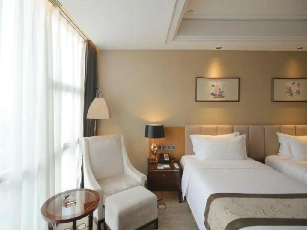 Bed in Zhangjiagang Zhonglian GDH International Hotel