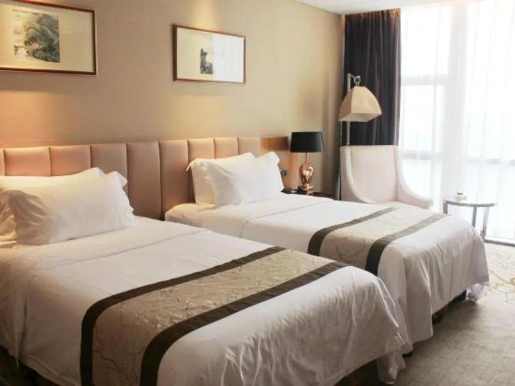 Bed in Zhangjiagang Zhonglian GDH International Hotel