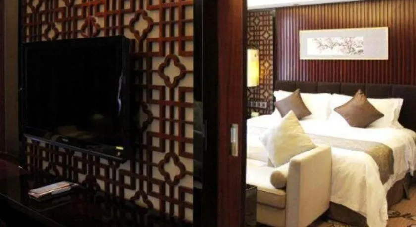 Bed in Zhangjiagang Zhonglian GDH International Hotel