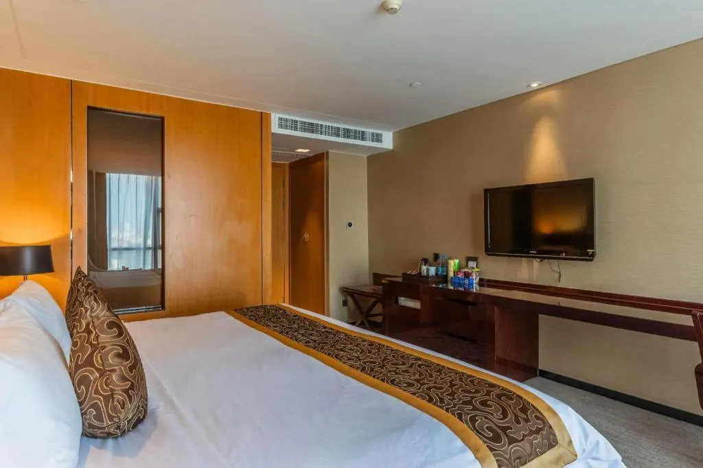 Bed in Zhangjiagang Zhonglian GDH International Hotel