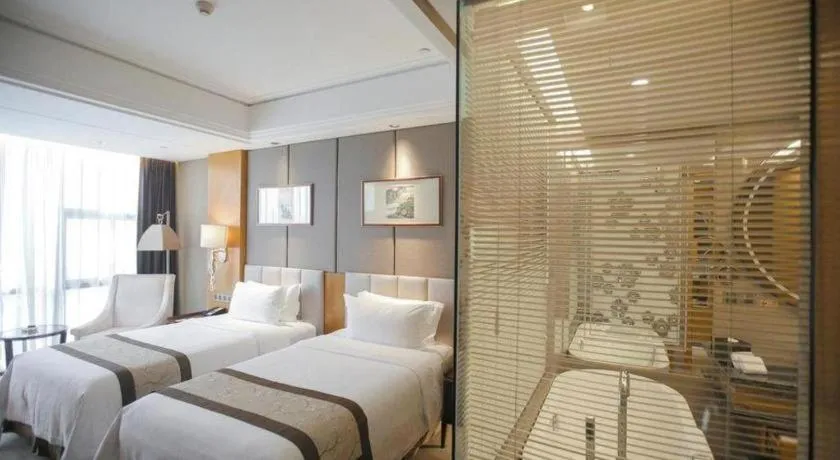 Bed in Zhangjiagang Zhonglian GDH International Hotel