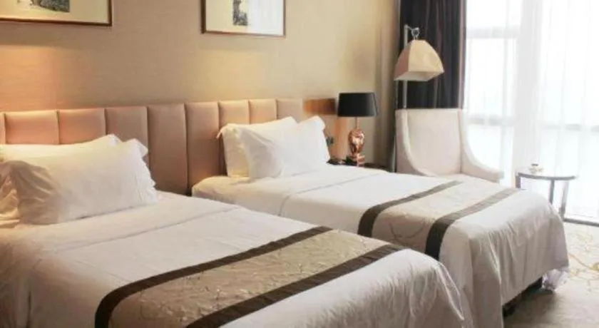 Bed in Zhangjiagang Zhonglian GDH International Hotel