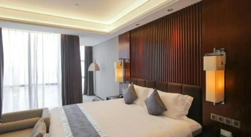 Bed in Zhangjiagang Zhonglian GDH International Hotel