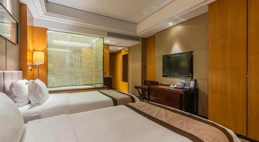 Bed in Zhangjiagang Zhonglian GDH International Hotel