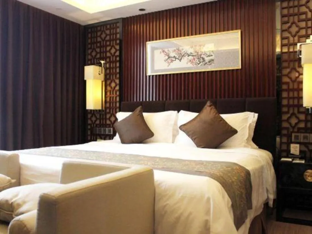 Bed in Zhangjiagang Zhonglian GDH International Hotel