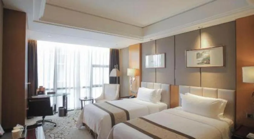 Bed in Zhangjiagang Zhonglian GDH International Hotel