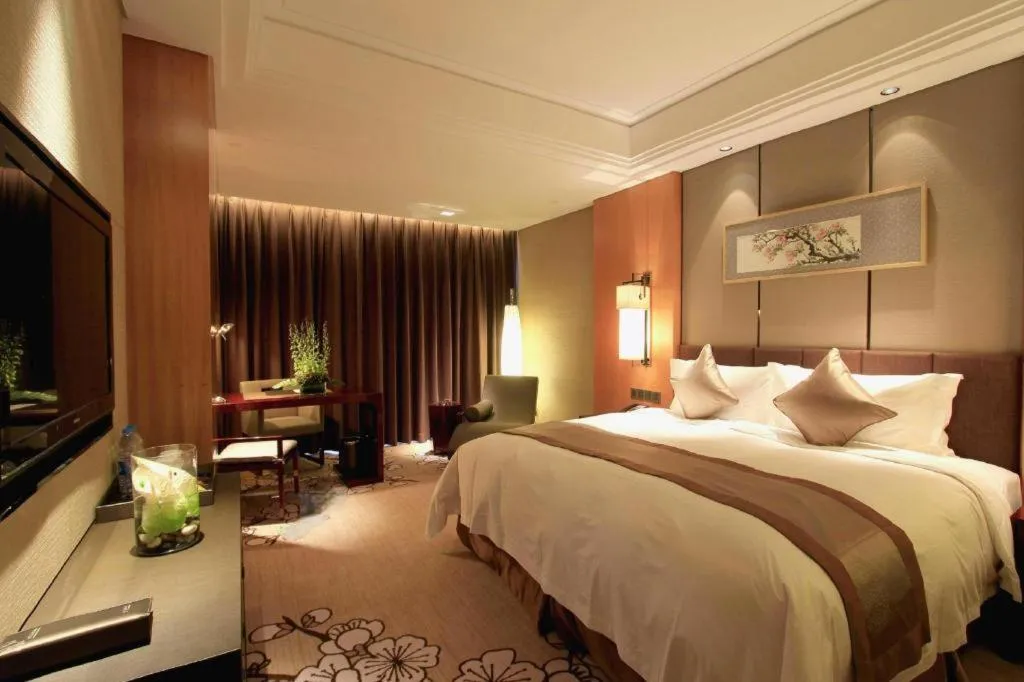 Bed in Zhangjiagang Zhonglian GDH International Hotel