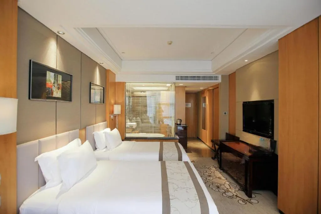 Bed in Zhangjiagang Zhonglian GDH International Hotel